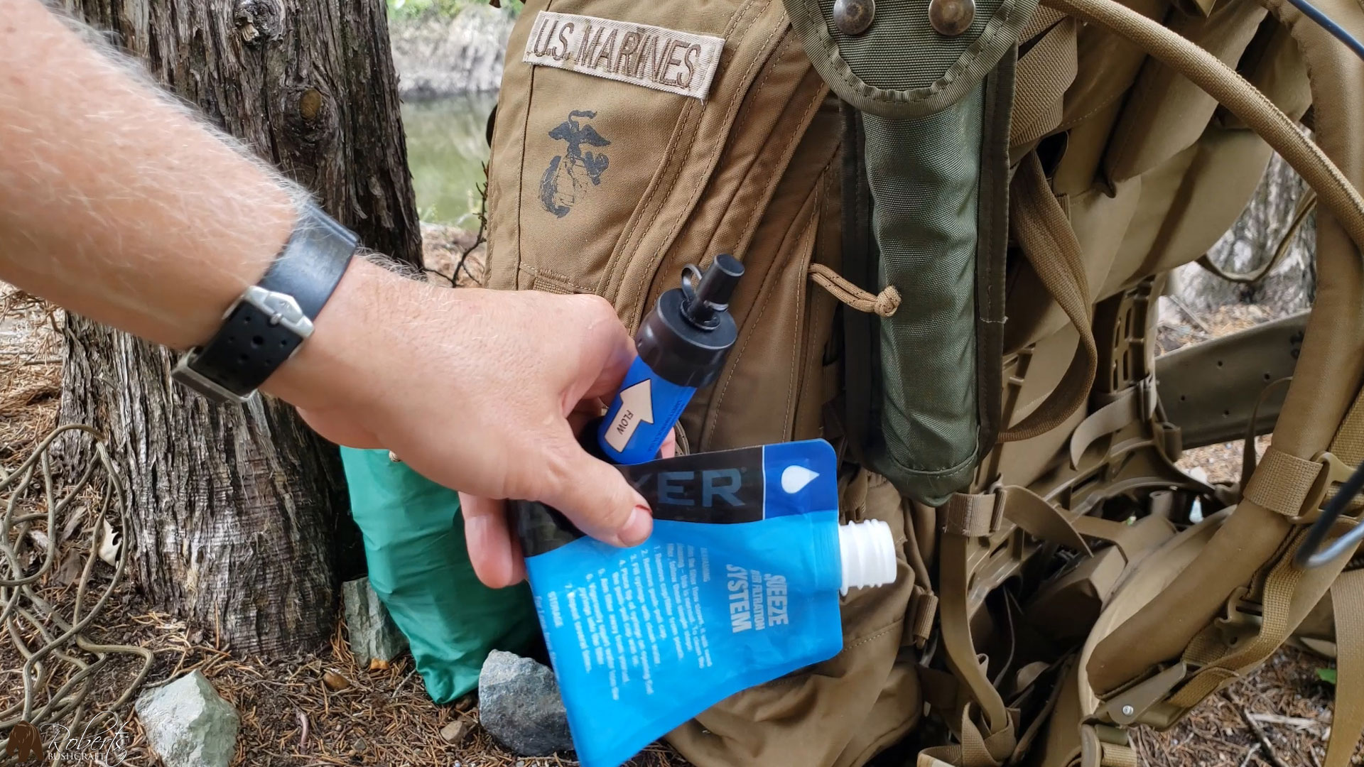 Sawyer mini water filter and squeeze bag inside of FILBE hydration carrier